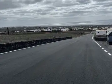 reasfaltado camino tendido eléctrico Mácher